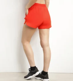 Short de sport femme en viscose orange Dim Move